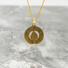 Crafted for the discerning Muslim woman, the Diwani Ayatul Kursi Necklace is a true masterpiece of Islamic jewelry. Made from high-quality 925 sterling silver and elegantly plated with 18K gold, this pendant is a blend of sophistication and faith. The intricate design featuring the Ayatul Kursi from the Quran adds a spiritual touch to any outfit. Whether worn as a daily reminder of faith or as a special gift, this necklace embodies both style and devotion. Elevate your jewelry collection with this symbolic piece that celebrates both beauty and faith in a subtle and elegant manner. Size of Pendant: 1x1" | 2.5x2.5 cm Weight of Pendant (Without Silver Chain): 0.14 oz | 3.8 gr Material of Pendant: 18K gold plated on Hypoallergenic 925 sterling silver. Length of Chain : 14 in - 35 cm | 16 in - Symbolic Round Necklace With Intricate Design, Brass Amulet Necklace With Polished Finish, Spiritual Gold Plated Necklace With Intricate Design, Spiritual Gold-plated Necklaces With Intricate Design, Spiritual Gold Plated Necklaces With Intricate Design, Amulet Style Jewelry With Polished Finish As Gift, Symbolic Necklace With Polished Finish As Gift, Symbolic Necklace With Polished Finish For Gift, Gift Amulet Jewelry With Polished Finish