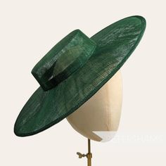 Boaters are all the rage, and this bottle green sinamay fascinator version has us all in a twirl!  Made from 2 layers of stiffened sinamay, these boaters are ready to trim and have a petersham ribbon on it's inside edge. Simply add a comb or headband to secure to the head. Hat base measures: Width: 36.5cm (14.4 inches) Crown Width: Please note that the crown is on the larger side, measures 16.5cm (6.5 inches) wide.  Crown Height: 4.5cm (1.7 inches) For even more millinery supplies you can find us here: www.etsy.com/shop/Petershams All orders are posted daily from London, England with expected delivery times of: Within the UK: 1-5 working days (by 1st Class Post) Outside the UK: 5-15 working days (by Standard Airmail) Upgraded traceable priority services are available for an extra cost, jus Green Fascinator, Sinamay Fascinator, Blank Hats, Straw Boater, Millinery Supplies, Hat Base, Crown Heights, Elegant Hats, Boater Hat