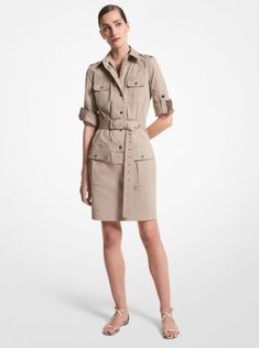 A modern juxtaposition of utility and luxury, this shirtdress is crafted from organic cotton poplin for a crisp feel. Flap pockets and a removable grommeted belt define the surplus-inspired design, while polished snap fastenings conceal a full-zip closure. Echo the season’s styling by wearing yours with flat sandals. Utility Style Summer Workwear Dresses, Utility Style Summer Dresses For Workwear, Summer Utility Workwear Dresses, Summer Utility Dresses For Workwear, Spring Utility Workwear Dress, Spring Utility Dress For Workwear, Knee-length Shirt Dress With Roll-up Sleeves For Work, Spring Workwear Dresses With Patch Pockets, Spring Workwear Dress With Flap Pockets