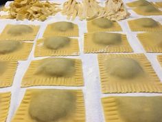 some uncooked ravioli sitting on top of a table