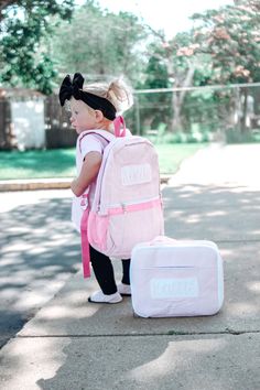 Our seersucker kids backpacks are not only adorable, but well made! They are lightweight and lined - perfect for kids! They feature a large exterior pocket on front as well as two exterior pockets. There is an additional large pocket inside for extra organization. Size: 16 x 13 x 3.5 Blue comes with faux leather name tag and name embroidered in white Pink comes with white seersucker name tag and name embroidered in pink If you prefer another style for the name or name tag, please send me a messa Cute Rectangular Diaper Bag, Preppy Pink Backpack For School, Pink Preppy Backpack For School, Preppy White Standard Backpack, Preppy White Rectangular Backpack, Back To School Gingham Backpack For Everyday Use, Gingham Backpack For Travel And School, Gingham Backpack For Everyday Use And Back To School, Back To School Gingham Travel Backpack