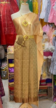 "This is Asian traditional dress is made from synthetic silk for top and skirt (adjust size by hook), length 36 inches. This dress set including with one sabai and one sarong . It is very unique and easy to wear. This item we have 2 type size. 1. Standard size Waist 23-30\" Hip max. 37 \" 2 Plus size Waist \" up to 42\" Hip up to 46\" Item not include blouse, jewelry, or accessory Note: - Each item may have very slight variances and imperfections due to the handmade process - The actual color ma Lao Clothing, Traditional Thai Dress, Laos Clothing, Plus Size Satin, Wedding Outfits For Groom, Thai Wedding Dress, Thai Wedding, Traditional Dresses Designs, Crystal Dress