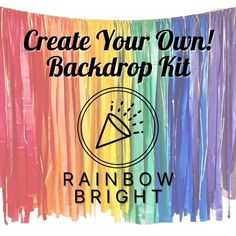 a rainbow streamer with the words create your own backdrop kit in front of it