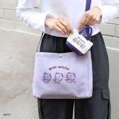 PRODUCT DETAILS CROSS BAG -Material: Cotton, Polyester - Size: 280 x 210 x 55mm MINI POUCH - Material: Cotton, Polyester - Size: 115 x 70 x 35mm ECO BAG - Material: Cotton - Size (excluding strap length): 350 x 380mm School Canvas Pouch For Mobile Phone, Purple Satchel Shoulder Bag, Purple Mobile Phone Bag For School, Purple School Bag With Mobile Phone Pocket, Cute Satchel Bag With Pockets, Cute Everyday Bags With Pockets, Cute Rectangular Bag With Pockets, Cute Rectangular Shoulder Bag With Zipper Pouch, Cute Purple Pouch Bag