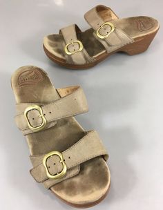 Dansko 6.5 - 7 US Beige Leather 2" Heels 2 Strap Slides Sandals 37EU Casual Low Heel Wedge Sandals With Buckle, Casual Low Heel Wedge Sandals With Buckle Closure, Medium Width Low Heel Wedge Sandals With Buckle, Vintage Slip-on Sandals With Buckle, Vintage Slip-on Sandals With Buckle Closure, Summer Low Heel Clogs With Buckle Closure, Low Heel Summer Clogs With Buckle Closure, Casual Low Heel Mules With Heel Loop, Beige Open Toe Clogs With Buckle Closure