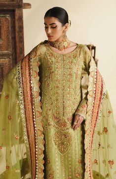 Elegant Green Churidar For Reception, Fitted Green Sets With Naqshi, Green Naqshi Salwar Kameez For Wedding, Anarkali Churidar With Naqshi For Wedding, Fitted Pista Green Sets With Naqshi Details, Wedding Lawn Suit With Intricate Embroidery, Formal Semi-stitched Naqshi Lehenga, Wedding Lawn Suit With Naqshi For Festivals, Green Naqshi Dupatta For Wedding