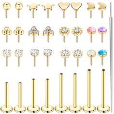 various types of piercings with different shapes and colors on them, all in gold