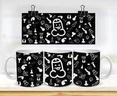 three coffee mugs with black and white designs on them