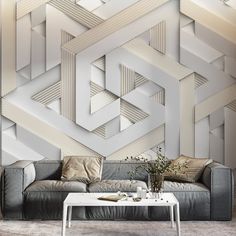 a living room with a couch, coffee table and wallpaper that looks like hexagonals