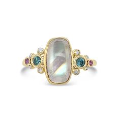 Set in 14k yellow gold this Rainbow Moonstone Cabochon is accented with Pink Sapphires and bright Blue Zircons. We set it in an open back bezel on a handmade 14k gold seagrass band. Approx stone size: 11mm x 11mm Approx ct weight: 3.6cts This one of a kind piece is handmade with love in our Hudson Valley studio. It is currently in stock and ready to ship Please allow for resizing if needed. If you have any questions or need more photos or help making your decision, please reach out! Peach Sapphire, Moonstone Cabochon, Alexandrite Ring, Bezel Ring, Rainbow Moonstone Ring, Orange Sapphire, Local Jewelry, Blue Zircon, Moonstone Ring