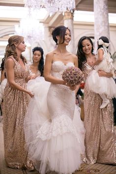 the bridesmaids are all dressed in gold and white gowns for their wedding