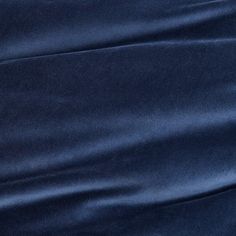 the fabric is very dark blue and it looks to be satin or polyestere