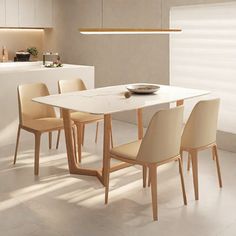 a dining room table with chairs and a bowl on it in front of a counter