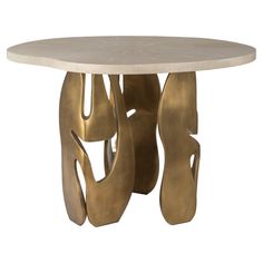 a round table with gold leaf design on it