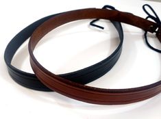 These simple leather crowns work great as either a basic circlet or as a hat band. Eyelets in the back allow for easy size adjustment. Bands measure 1/2 inch wide and are available in multiple colors. The circlet measures 20 inches when laid flat, and laces closed through eyelets on the back to adjust to fit your head. Additional styles of crowns and cuffs are also available - take a look at my additional available items! Your leather crown will be shipped first class within three weeks. Fantasy Barbarian, Winter Cloak, Leather Crown, Simple Leather, Costume Hats, Medieval Fantasy, Hat Band, Multiple Color, Leather Working