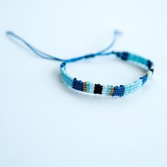 Introducing our versatile and stylish unisex braided bracelet – an everyday essential that adds a touch of charm to any outfit. Whether you're strolling along the beach, soaking up the summer sun, or just adding a casual flair to your daily look, this bracelet is the perfect choice. 🌟 Minimalist Design: Crafted with a minimalist aesthetic, this woven bracelet is designed to complement a variety of styles, making it an ideal accessory for both men and women. 🌊 Beachy Vibes: Embrace the carefree spirit of summer with this fun beach jewelry. The braided design brings to mind memories of sandy shores and the soothing rhythm of ocean waves. 👫 Symbol of Friendship: A timeless symbol of connection and friendship, this friendship bracelet is a wonderful gift for a friend, loved one, or even you Adjustable Wrap Bracelet For Friendship In Summer, Blue Bohemian Friendship Bracelets For Everyday, Adjustable Beaded Braided Bracelets For Everyday, Casual Braided Bracelets For Summer Beach, Casual Braided Bracelets For Beach In Summer, Trendy Beaded Strand Friendship Bracelets, Trendy Adjustable Friendship Bracelets For Beach, Trendy Beaded Braided Bracelets For Beach, Casual Black Beaded Bracelets For Friendship