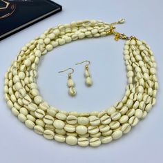 Elevate your style with our Elegant Ivory White Multi Strand Necklace. This chunky beaded statement piece is handcrafted with multiple layers of smooth ivory beads, offering a sophisticated touch to any outfit. Perfect as a thoughtful gift for her, this necklace is designed to impress, making it an exquisite addition to any woman's jewelry collection. This is a handcrafted necklace, uniquely designed with attention to every detail. - Necklace length is 17.5" long, 7 STRANDS plus additional 4 inc White Beaded Necklace, White Beaded Necklaces, Autumn Necklace, Thoughtful Gifts For Her, Christmas Necklace, Pure Elegance, Necklace Chunky, Handcrafted Necklace, Classic Jewelry