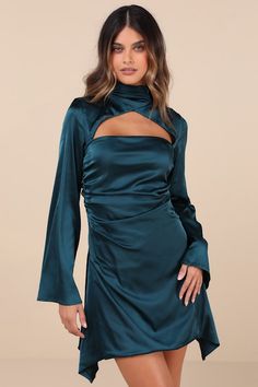 Get ready to be the most stunning sight at any party this season with the Lulus Sultry Elevation Dark Teal Satin Long Sleeve Cutout Mini Dress! Sleek, stretch-woven satin shapes this must-have dress that features long sleeves with flaring cuffs, flowing into an overlapping crisscross design that creates a chic mock neckline. Flirty cutouts at the front and back sit above the figure-flaunting silhouette that boasts ruching along the sides and continues down to an A-line mini skirt with a draping, asymmetrical hem. Button-loop closures secure the neckline. Hidden zipper/clasp at back. Fit: This garment fits true to size. Length: Mid-thigh. Size medium measures 44.5" from shoulder to hem. Bust: Great for any cup size. Waist: Fitted - very fitted at natural waist. Hip: Not Fitted - fuller skir Cutout Mini Dress, Satin Long Sleeve, A Line Mini Skirt, Mock Neckline, Dark Teal, Cutout Dress, Asymmetrical Hem, Cup Size, Dress 100