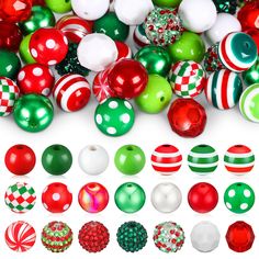 many different colored balls and ornaments on a white surface