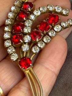 Large vintage gold tone brooch with a roll over clasp, claw set red and white paste stones Vintage Red Jewelry With Rhinestones, Red Brooch Jewelry For Formal Occasions, Red Formal Costume Jewelry Brooches, Antique Red Brooch, Antique Red Brooch Jewelry, Vintage Red Brooches For Formal Occasions, Antique Red Brooch For Formal Occasions, Red Costume Jewelry Brooch, Vintage Red Rhinestone Jewelry