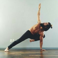 a man is doing yoga on the floor