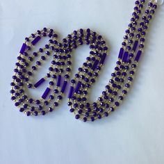 This women's waist bead is a unique and handcrafted accessory that is ready to ship. The beads are made with  gold and blue crystals glass beads, which provide a beautiful and eye-catching appearance. The colors of the beads are the same, but the design may vary, making each strand of waist beads unique and one-of-a-kind. The tie-on waist beads are easy to wear and adjust, ensuring a comfortable fit for the wearer. Each purchase is for one strand of waist beads, which is approximately 60 inches Colorful Crystal Beads For Party, Party Gold Crystal Necklaces With Colorful Beads, Gold Crystal Necklaces With Faceted Beads For Party, Gold Crystal Necklaces With Round Beads For Party, Party Crystal Beads Colorful, Gold Beaded Crystal Necklaces, Party Crystal Necklaces With Polished Round Beads, Purple Tiny Beads Party Jewelry, Gold Waist Chain With Colorful Round Beads