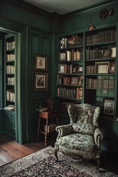 a room with green walls and bookshelves filled with lots of bookcases