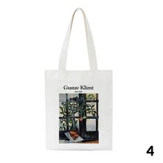 a white tote bag with an image of a houseplant on the front