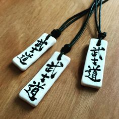 Thank you for visiting Dragon Ikka Etsy Shop. Bushido 武士道 necklace in Japanese Calligraphy on about 1~ 1 1/2 inch x 2/3 inch plate. I will make with your choice of colors. 1 yard Waxed cotton cord will be adjustable as choker or long necklace.  If you contact me to specify the length you would like, I will custom fit it for you. This necklace would look great on men and women. *Sending you with USPS delivery confirmation Number to track your package. Hand Painted Necklace, Clay Keychain, Japanese Calligraphy, Chocolate Box, Cotton Cord, Waxed Cotton, Custom Fit, Long Necklace, Beautiful Necklaces