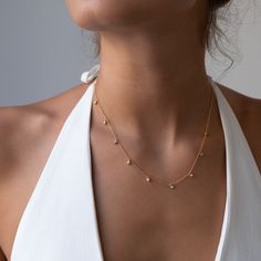 Our popular Diamond Droplet necklace is now available in three variations: ✦ 18 k solid gold chain diamond cut ball chain✦ 13 diamond droplets 0.67 ctw✦ 9 diamond droplets 0.42 ctw✦ 1 diamond droplet 0.06 ctw✦ White diamonds measuring 2mm✦ Color G/H //Clarity SI1/SI2// Full Cut✦ Chain can be adjusted from 14-17 inches✦ Hallmarked 750 VFD ✦ Packaged in our elegant black Vivien Frank Jewelery box Briolette Diamond Necklace With Delicate Chain, Delicate Briolette Diamond Necklace, Dainty Drop Diamond Necklaces, Dainty Station Necklace With Single Cut Diamonds, Dainty Diamond Drop Necklace With Diamond Accents, Dainty Drop Diamond Necklace With Accents, Dainty Diamond Drop Necklace With Delicate Chain, Dainty Drop Diamond Necklace, Delicate Diamond Drop Necklace With Delicate Chain