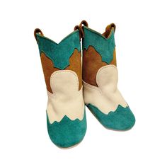 New to the shop! These leather baby boots are made to order. Please message us for any information on sizing or colour availability. Our adorable turquoise, toast and white genuine leather baby cowboy boots are ready just in time for rodeo season and for summer celebrations. Our baby boots are handcrafted from split suede leather plus a coordinating trim leather and / or beading. Each pair features a convenient hook and loop tab up the back of the upper for simple dressing. Made to order, the co Leather Boots With Round Toe For Playtime, Cute Boots With Soft Sole And Closed Toe, Cute Brown Booties For Playtime, Cute Leather Closed Toe Boots, Baby Cowboy Boots, Simple Dressing, Summer Celebration, Baby Cowboy, Leather Baby