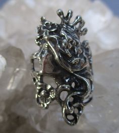 A beautiful Art Nouveau style Princess ring is hand cast in Sterling Silver. Long Flowing Hair, a Crown, and fine details are antiqued to bring out the highlights. The ring is about 1 3/16 inch long at the top and tapers down to a plain shank in the back. It is made in a size 7 1/2. I will wrap the ring in gift box and mail in a small box within 1-2 days of purchase, usually one. First Class postage with tracking is free in the U.S. . Ask about international shipping! Antique Hand Cast Jewelry Ring, Antique Engraved Silver Ring, Antique Hand Cast Rings For Anniversary, Hand Cast Antique Rings For Anniversary, Antique Hand Cast Silver Rings, Vintage Hand Cast Rings For Anniversary, Hand Cast Vintage Rings For Anniversary, Vintage Hand-cast Rings For Anniversary, Vintage Oxidized Rings For Collectors