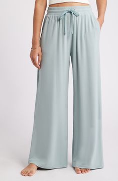 Feel the soft comfort of these lounge-worthy pants punctuated with flowy wide legs. 29" inseam; 26" leg opening; 12" front rise; 15" back rise (size medium) Elastic/drawstring waist Side pockets 95% Tencel® modal, 5% spandex Tencel modal is a sustainably produced fiber made with closed-loop processing and is certified with the EU Ecolabel as having a low environmental impact throughout the entire lifecycle Machine wash, dry flat Imported Comfortable Wide Leg Pants For Summer Lounging, Comfortable Wide Leg Pants For Lounging In Summer, Solid Color Wide Leg Lounging Bottoms, Wide Leg Pants With Comfort Waistband For Lounging, Wide Leg Pants With Elastic Waistband For Lounging, Versatile Viscose Bottoms For Loungewear, Versatile Wide-leg Lounging Bottoms, Wide-leg Lounging Bottoms, Versatile Viscose Loungewear Bottoms