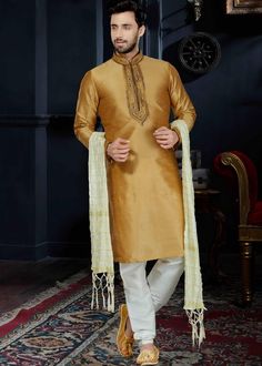 Readymade art #silk #kurta in #golden decked with #mandarin neck, lace, full length sleeves. Gold Semi-stitched Chanderi Sherwani, Gold Silk Sherwani For Eid, Gold Silk Bollywood Sherwani, Gold Silk Kurta With Dabka Detail, Gold Silk Kurta With Dabka, Gold Chanderi Bandhgala With Traditional Drape, Gold Bandhgala In Chanderi With Traditional Drape, Transitional Gold Chanderi Bandhgala, Gold Silk Sherwani For Festive Season