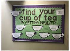 a sign that says find your cup of tea by getting involved on the front wall