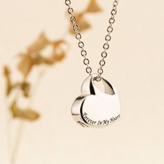 This heart-shaped urn drop necklace is not just a piece of jewelry; it's a precious keepsake that allows you to hold the memories of your loved ones close to your heart. Whether it's a cherished human companion or a beloved pet, this necklace is a touching way to keep their ashes with you, a beautiful remembrance of the love and connection you shared. Key Features: Handmade Craftsmanship: Each heart-shaped urn drop necklace is meticulously handcrafted with care and attention to detail. Our skill Nickel-free Heart Pendant Necklace For Personalized Gift, Memorial Heart Charm Open Heart Necklace, Personalized Heart Pendant Necklace For Memorial, Engraved Heart Necklace For Valentine's Day Memorial, Memorial Open Heart Necklace With Heart Charm, Memorial Open Heart Charm Necklace, Stainless Steel Teardrop Necklace For Gift, Valentine's Day Open Heart Keepsake Charm Necklace, Valentine's Day Keepsake Open Heart Charm Necklace