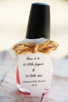 a bottle with a tag on it that says home is as 10 little fingers & 10 little toes