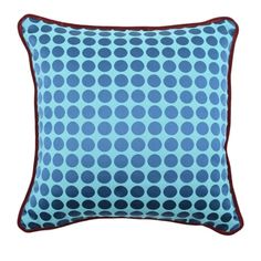 a blue and red pillow with circles on it