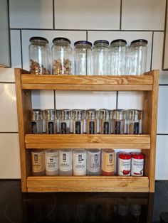 an old spice rack is filled with jars and spices