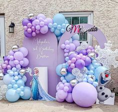 a frozen princess birthday party with balloons and decorations