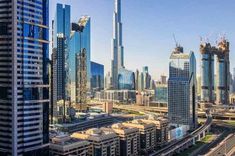 an aerial view of skyscrapers and roads in the middle of dubai, united kingdom