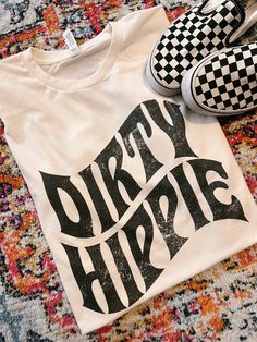 Dirty Hippie Trendy White Festival T-shirt, Trendy White T-shirt For Festivals, White Relaxed Fit T-shirt For Festival, White Hippie Crew Neck T-shirt, White Crew Neck Hippie T-shirt, Free-spirited Cotton T-shirt With Graphic Print, White Hippie Tops With Letter Print, White Relaxed Fit Hippie T-shirt, Hippie Soft-washed Cotton T-shirt