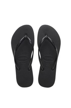 Strap: 100% synthetic/PVC Sole: 100% rubber Thong style Cushioned footbed with textured rice pattern and rubber flip flop sole Made in Brazil Casual Cheap Strappy Flip Flops, Le Rosey, Slim Logo, Wide Sandals, Wide Fit Sandals, Dr Shoes, Wide Width Sandals, Rubber Flip Flops, Havaianas Flip Flops