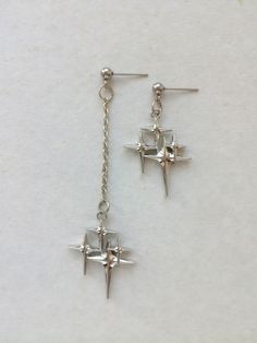 The earrings are adorned with a small star-shaped pendant. The earrings are fastened with stainless steel studs. Earring length - 7.0 cm (2.7 inches) Earrings are packed in a gift box RECOMMENDATIONS FOR CARE: Do not wet, do not drop, and store in a dark box! - Remove jewelry before exercising, swimming, showering and sleeping. - Avoid contact with moisture such as make-up, moisturizer, lotion, perfume and hairspray. - Store your jewelry in a box or pouch after use. Girlfriend Earrings, Earrings Grunge, Rock Y2k, Silver Star Earrings, Celestial Earrings, Gothic Earrings, Funky Jewelry, Grunge Goth, Rock Stars