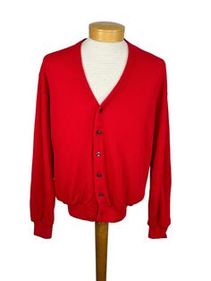 "1960s red cardigan knit sweater made of orlon (acrylic). Very nice finely knitted sweater!  It buttons up the front with dark gray pearly buttons. Made by John F. Excellent condition. Measurements Shoulder 19.5\" Chest 45\" Waist 27\" - 34\" Length 27\" Sleeves 34\" Please note that sizes listed in the title, such as S, M or L, are estimates based on the measurements of the garment and used for search purposes. Please take note of the actual measurements and compare with an item of clothing you Red V-neck Sweater With Button Closure, Classic Red Fitted Cardigan, Classic Fitted Red Cardigan, Classic Red V-neck Sweater For Fall, Red Button-up Cardigan, Red Button-up Cardigan With Buttons, Red Knit Sweater With Buttons, Red Button-up Sweater, Classic Red Long Sleeve Sweater