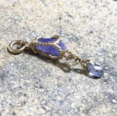 "Please go to my Instagram to watch the video about this pendant ~ A lovely genuine purple-blue color tanzanite glistens in a hollow 14k yellow gold wire bezel. Set with a light blue color sapphire bead is so fiery, vibrant and intense! A unique little piece with so much character. All handcrafted by me in my Michigan studio. Gem: approx. 12mm x 7mm / 2.15ct / genuine purple-blue tanzanite / with inclusions and imperfection surface 6mm x 3mm/ genuine light blue bead / with inclusions and imperfe Lavender Tanzanite Jewelry For Gifts, Yellow Gold Tanzanite Jewelry With Birthstone, Handmade Tanzanite Yellow Gold Jewelry, Gold Tanzanite Pendant Jewelry, Tanzanite Birthstone Pendant Jewelry, Tanzanite Birthstone Pendant, Yellow Gold Tanzanite Pendant Necklace, Tanzanite Gemstone Round Pendant, Boulder Opal Ring