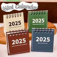 three mini calendars sitting on top of a table