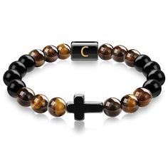 "This Item is Handmade" Enhance your spiritual journey with our Cross Tiger Eye Bracelet with Initial Charm. This exquisite piece is crafted from high-quality Tiger Eye stones, known for their protective and grounding properties. The beaded bracelet features a stylish cross pendant and a customizable initial letter, making it a perfect personalized bracelet for both men and women. Each handmade bracelet is meticulously designed to bring you good luck and protection. The durable elastic cord ensures a comfortable fit, while the natural stone beads offer a touch of elegance to any outfit. Whether you're looking for a fashion accessory or a meaningful gift, this bracelet is the ideal choice. Features: Natural Tiger Eye Stones: Known for their protective and grounding properties. Cross Pendant Spiritual Bracelets With Polished Beads For Meditation, Spiritual Polished Beads Bracelets For Meditation, Spiritual Adjustable Wristband With Letter Beads, Adjustable Spiritual Wristband With Letter Beads, Symbolic Beaded Bracelets With 8mm Beads, Adjustable Spiritual Crystal Bracelet With Polished Beads, Adjustable Natural Stones Rosary Bracelet For Meditation, Adjustable Rosary Bracelet With Natural Stones For Meditation, Spiritual Letter Beads Wristband