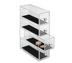 three clear drawers are stacked on top of each other