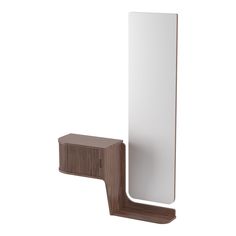 a mirror mounted on the wall next to a wooden holder with a shelf underneath it